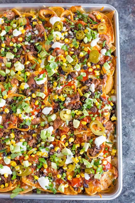 A sheet pan full of loaded nachos. Nacho Dips, Nacho Bar Ideas, Nachos In Oven, Best Nacho Recipe, Nacho Recipes, Antipasto Appetizer, Brown Eyed Baker, Nachos Recipe Easy, Nacho Bar