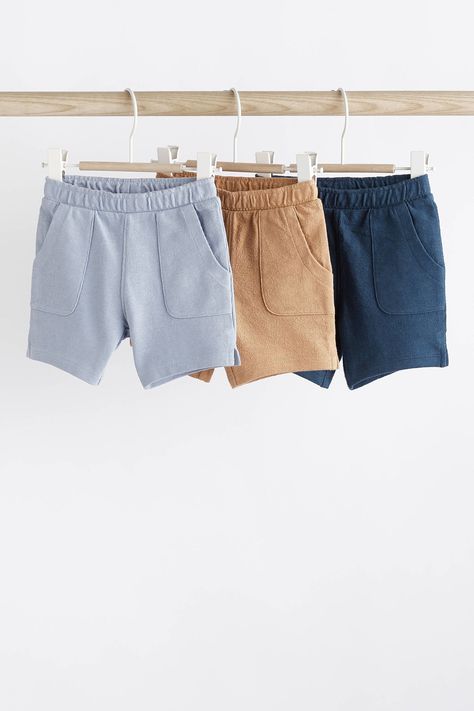 Fill their wardrobe with summer staples, thanks to this handy 3-pack of shorts, crafted from pure cotton in an elevated textured finish. Each pair of shorts has an elasticated waistband and side pockets for easy wear. Machine washable. 3 x Shorts 100% Cotton. Monochrome Baby, High Waisted Cropped Jeans, Brown Babies, Cotton Texture, Slippers For Girls, Chunky Knitwear, Baby Shorts, Navy And Brown, Swimwear Shorts