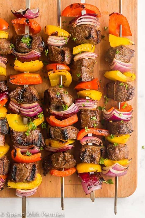 Beef Shish kabobs are a summer staple! Made with sirloin steak tossed in a homemade marinade and threaded onto skewers with your choice of veggies, they are the best grilling recipe. #spendwithpennies #beefshishkabobs #beefskewers #beefkabobs #beef #steak #skewer #grilling #easygrillingrecipes Kabobs Blackstone, Beef Kabobs On The Grill Marinade, Beef Skewers Grill Kabob Recipes, Summer Entertaining Food, Beef Kabobs On The Grill, Beef Kebobs, Kebab Marinade, Summer Kabobs, Steak Kabob Marinade