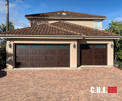 The timeless style, expert craftsmanship, and attention to detail will create a lasting impression. This is our Stamped Shaker garage door in Walnut Accents Woodtones. Spanish Transitional, Brown Garage Door, Walnut Accents, Custom Wood Garage Doors, Contemporary Garage Doors, Garage Door Sizes, Garage Door Colors, Contemporary Garage, Carriage Garage Doors