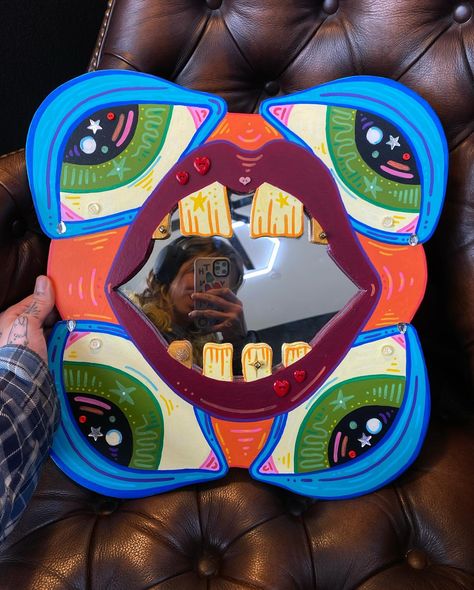 another CUSTOM funky face mirror (finished a month or so ago) 🦷👁️✨ #customdecor #homedecor #diydecor #diydecoration #woodworking #woodcrafting #eclecticdecor Mushroom Painting On Mirror, Groovy Mirror Diy, Mushroom Painted Mirror, Trippy Mirror Art, Mirror Paintings, Mirror Graffiti Aesthetic, Face Mirror, Mirror Painting, April 13