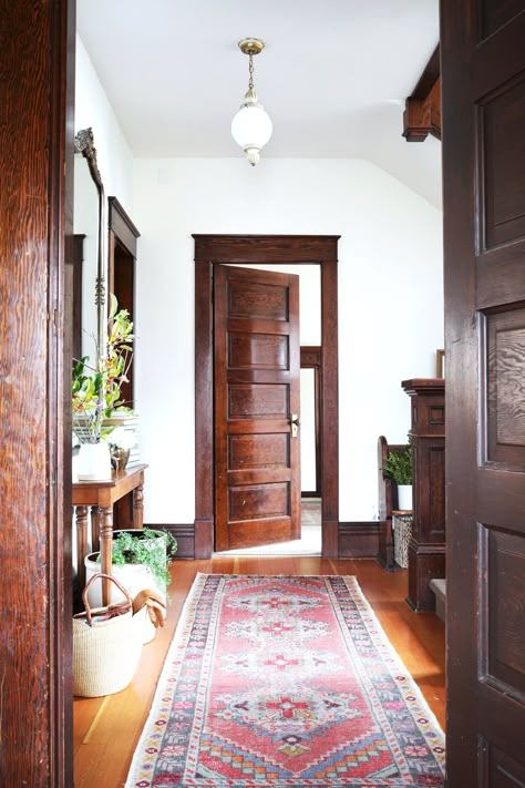 how to buy and care for vintage rugs // the Grit and Polish Wood Trim And White Doors, White Room With Colored Trim, White Walls Dark Brown Trim, Wood Floors With Wood Trim, Modern With Antique Decor, Mcm Trim, Brown Baseboards, Gray Trim Interior, Wood Baseboards And Trim