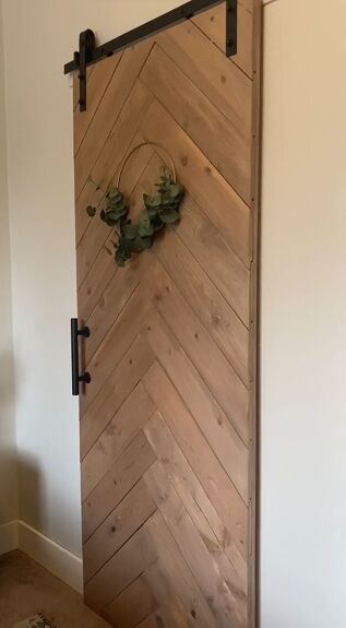 How to Build a DIY Barn Door With a Shiplap Design | Hometalk Herringbone Barn Door Diy, Diy Barn Door Cheap, Shiplap Door, Hayden Homes, Barn Door Projects, Shiplap Boards, Space Saving Hacks, Diy Sliding Barn Door, Diy Barn