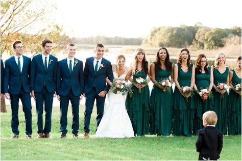 Bridal party and groomsmen, forest green bridesmaid dresses, navy suits Green Suit Green Dress, Navy Suit Emerald Dress, Emerald Green Bridesmaid Dresses And Navy Suits, Dark Green Bridesmaid And Groomsmen, Emerald Green Bridesmaid Dresses And Navy Blue Suits, Green Bridesmaid Dress And Groomsmen, Navy Blue And Green Groomsmen, Navy And Emerald Wedding Party, Emerald Green And Dark Blue Wedding