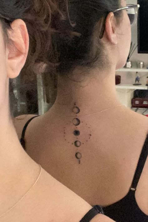 26 Celestial Star Neck Tattoo Ideas For Beauty Moon Phases On Spine Tattoo, Moon Phases Tattoo With Quote, 3 Moon Phases Tattoo, Back Moon Phases Tattoo, Moon Phases On Spine, Moon Phase Hip Tattoo, Moon Phases Back Tattoo Women, Moon Phases Tattoo Placement, Moon Phases Ear Tattoo