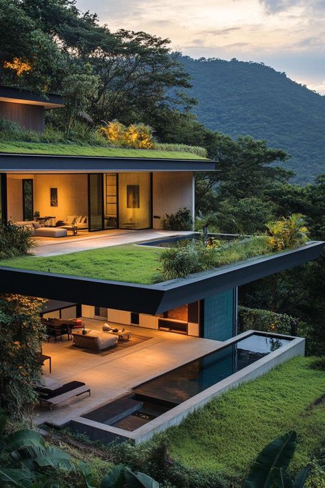 Modern house on a slope with green roof and lush forest views. Check out these innovative modern houses on a slope that make the most of the terrain, turning challenges into stunning architectural features. Sloping Site House Design, House In Slope Terrain, Slope House Design Architecture, Slope Roof Elevation, Forest House Modern, Steep Slope House Design, Houses On A Slope, Building On A Slope, Hillside Architecture