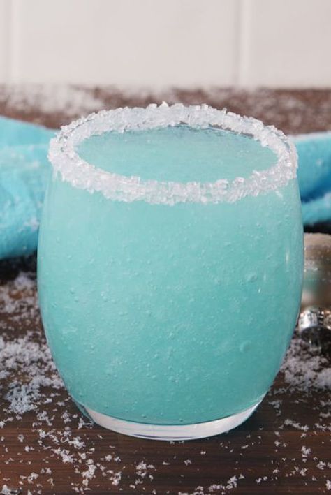 Drunk Jack Frost 1 c. vodka 1 c. Champagne 1/2 c. Blue Curacao 1/2 c. lemonade 3 c. ice Lemon wedge white sanding sugar Vodka Slushies, Summer Drinks Nonalcoholic, Christmas Drinks Alcohol Recipes, Spiked Lemonade, Blue Drink, Summer Drinks Alcohol, Summer Drink Recipes, Christmas Cocktail, Festive Drinks