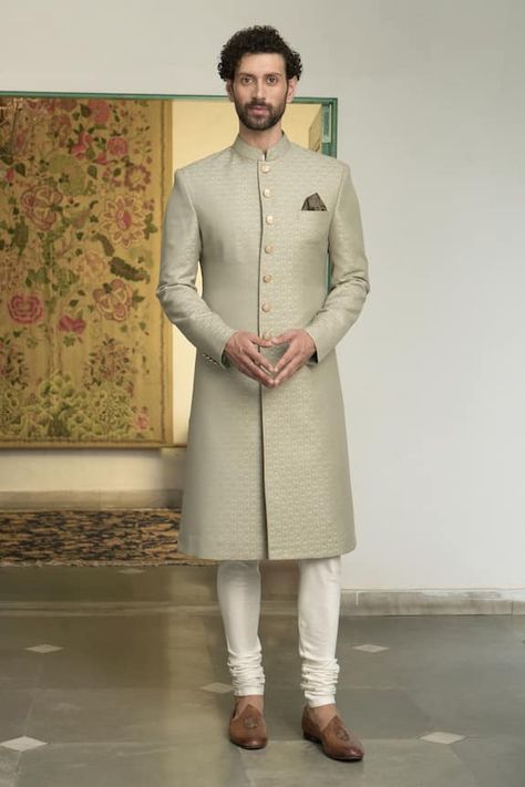 Olive green sherwani with all over floral patterns and carved buttons. Comes with inner kurta and churidar. - Aza Fashions Green Sherwani, Wedding Matching Outfits, Indian Wedding Suits Men, Sherwani Groom, Reception Outfit, Sherwani For Men, Dress Men, Green Lehenga, Wedding Dress Men