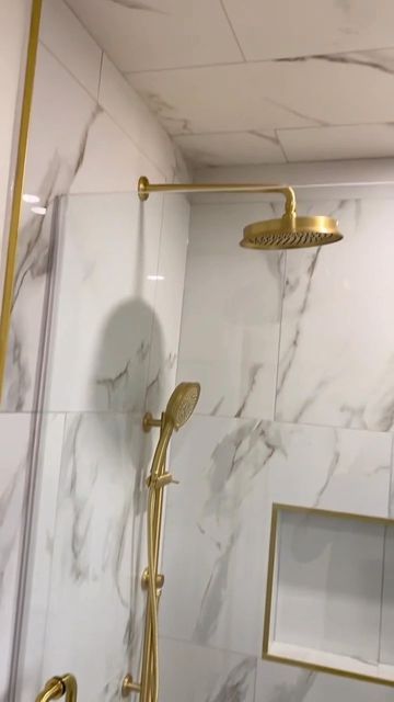 Vogt • Kitchen & Bath Fixtures on Instagram: "Dripping in Gold. Bathroom remodel by @newellsquality Featured Collection: Zehn Featured Finish: Brushed Gold #Vogt #Bathroom #BathroomRenovation #Bathroom #Shower #ShowerDesign #ShowerRenovation" White Gray Gold Bathroom, Shower With Gold Accents, Gold Bathroom Shower Fixtures, Gold Restroom Decor Ideas, Brushed Gold Shower Fixtures, Cream And Gold Bathroom Ideas, Bathroom Gold Fixtures, Brushed Gold Bathroom Fixtures, Gold Shower Fixtures