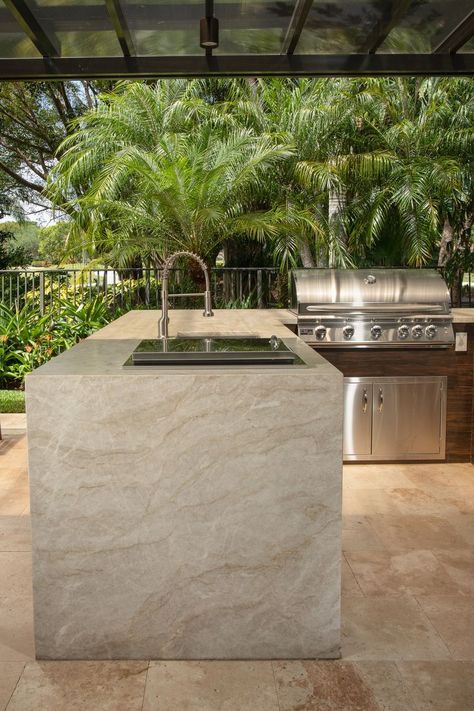 Taj Mahal Quartzite Kitchen project created using Quartzite slabs from Primestones®, Premier Stone Provider in South Florida with locations in Miami, WPB and Broward. #tajmahal #quartzite #tajmahalquartzite #contemporarykitchen #modernkitchen #naturalstonecountertop #naturalstoneflooring #naturalstone #kitchen #kitchendecor #kitcheninspiration #interiordesign #quartzitecountertops #quartzitekitchen Marble Outdoor Kitchen, Kitchen With Taj Mahal Countertops, Outdoor Countertops, Outdoor Stone Kitchen, Taj Mahal Quartzite Waterfall Island, Travertine Outdoor Kitchen, Quartzite Taj Mahal, Tan Mahal Quartzite Kitchen, Outdoor Kitchen Design Ideas