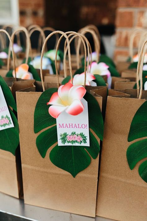 Throwing the Ultimate Luau Birthday Party — The Celebrate Daily Luau Gift Bags, Tropical Theme Birthday Party Decor, Hawaiian Theme Party Favors, Hawaii Themed First Birthday, Luau Party Favor Ideas, Tiki Luau Party Ideas, Hawaiian 21st Birthday Party, Tropical Birthday Party Favors, Luau Party Ideas For Adults Decoration