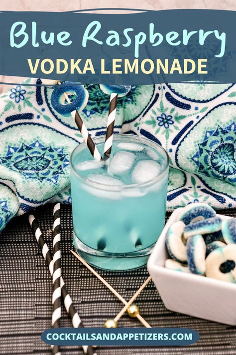 This blue raspberry cocktail is a light and fruity drink with a gorgeous summery color! Combine blue raspberry lemonade with Svedka vodka  to make delicious mixed summer drinks. Garnish with gummy rings for a fun and creative garnish idea. An easy alcoholic drink to make and you can easily turn it into a frozen vodka cocktail if you like. One of our favorite summer drink recipes. Blue Raspberry Vodka Cocktails, Smirnoff Blue Raspberry Lemonade Recipes, Blue Raspberry Vodka Drinks, Sweet And Sour Drink, Raspberry Vodka Drinks, Raspberry Lemonade Vodka, Blue Alcoholic Drinks, Alcoholic Drinks Vodka, Gummy Rings