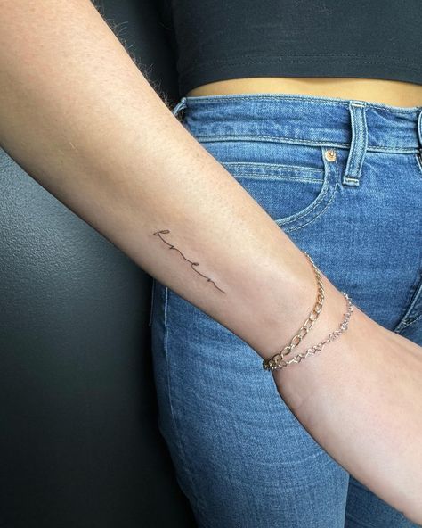 Fine line tattoo, tiny tattoo, small tattoo, script tattoo, cursive tattoo Fine Line Cursive Tattoo, Small Script Tattoo Placement, Side Of Wrist Tattoo, Last Name Tattoo For Women, Fine Line Script Tattoo, Script Tattoo Placement, Above Elbow Tattoos For Women, Above Elbow Tattoo, Cursive Tattoos