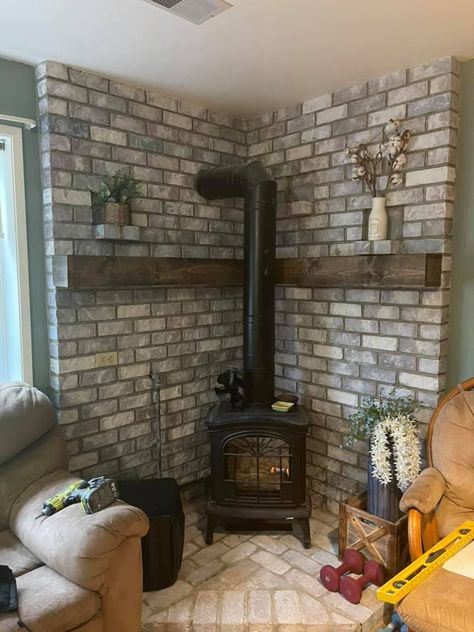 Brick Pellet Stove Hearth, Corner Brick Wood Stove, Wood Burning Stove Backsplash, Corner Pellet Stove Ideas Living Rooms, Wood Stove Corner Ideas, Stove Makeover, Corner Mantle, Pellet Stove Hearth, Wood Stove Decor