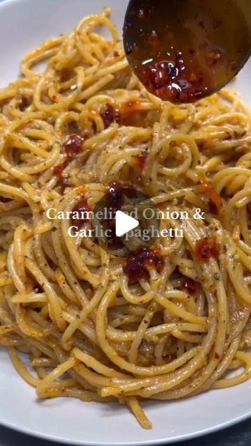 Mediterranean Plan Meal on Instagram: "Caramelized Onion and Garlic Spaghetti 🔥 

Ingredients:
- Chilli oils
-1 large onion, thinly sliced
-4 cloves of garlic, minced, plus more for garlic chili crisp
-2 tablespoons of garlic chili crisp, plus more for serving (we use @ramanokram’s garlic chilli oil - so good)
-Salt and pepper, to taste
-1 cup of coconut milk or cream
-1 teaspoon of dry parsley
-8 ounces of pasta (your choice of shape)
-Olive oil

Instructions:
1. Start by preparing all your ingredients. Thinly slice the onion, mince the garlic, and measure out your garlic chili crisp, coconut milk or cream, and dry parsley. Set aside.
2. In a large skillet over medium heat, add a couple of tablespoons of olive oil. Once the oil is hot, add the sliced onions with a pinch of salt. Cook, st Caramelized Onion Garlic Spaghetti, Caramelized Onion And Chili Oil Pasta, Garlic Chili Crisp, Chilli Oil Garlic Butter Pasta, Carmalized Onion Garlic Pasta, Garlic Chilli Oil, Crunchy Garlic Chili Oil, Chilli Pasta, Chili Crunch