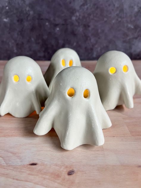 The perfect cute addition to your spooky season decor! These little ghosts are ready to grace your shelves and tables with the flickering light of a tea light candle. Order includes one ghost cover and tea light base. Tea light candles not included. Due to the handmade nature of this item, each ghost is one of a kind. The next round of ghosts is expected to ship by the end of August 2024. Tea Candle Cover, Ghost Tea Lights, Ghost Tea Light Covers, Clay Ghost Tealights, Halloween Clay Projects, Ceramic Ghosts, Clay Ghosts, Halloween Ceramics, Ghost Ceramic