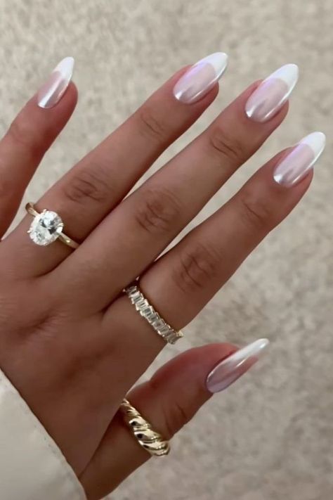 Are you in search of some attractive white nail designs to experiment with during this season? If yes, then you have landed on the right article! As summer is approaching, I have curated a list of my preferred styles to offer you some ideas. I have included various designs ranging from abstract to indie to cater to different preferences.Many of these styles can be easily replicated in the comfort of your own home! If you’re interested in trying a matte style, Metallic Nails Design Chrome, White And Chrome French Tip Nails, Spring Metallic Nails, Chrome White Nails Designs, White Chrome Nails With Glitter, Hombre Chrome Nails, White Gold Silver Nails, Ombre Metallic Nails, Chrome Dipped Nails