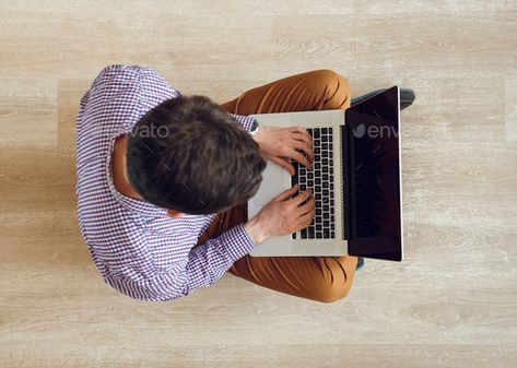 Top view of man sitting on the floor and working with a laptop by vlad_star. Top view of young man sitting on the floor and working with a laptop#man, #sitting, #Top, #view Human Back, Food Photography Tutorial, Table Top View, Event Flyer Templates, Man Sitting, Person Sitting, Happy Design, Poster Background Design, Event Flyer