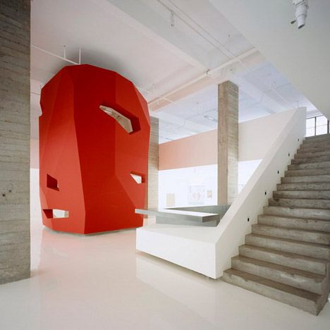 This clever faceted red volume in a Shanghai office, designed by 3Gatti Architecture Studio of Rome and Shanghai, houses two meeting rooms and a cafe. Emphasis In Architecture, Emphasis In Interior Design, Groovy Office, Red Architecture, Luxury Stairs, Concrete Interiors, Colour Architecture, Hospital Interior, Office Furniture Accessories