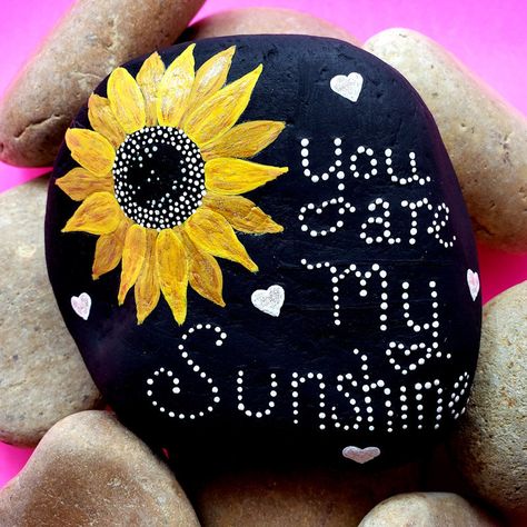 Rock Painting Ideas Sunflower, You Are My Sunshine Painted Rock, Sunflowers Painted On Rocks, Sunflower Painted Rocks Ideas, Things To Paint On A Rock, Painted Rocks Sunflower, Cute And Easy Things To Paint On Rocks, Large Painted Rocks For The Garden, Painted Rock Garden Ideas