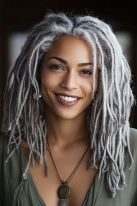 Silver dreadlocks offer a unique, textural look that’s perfect for those who love a bohemian aesthetic. The silver color makes the dreads look like spun metal, offering a fresh take on a classic style. Click here to check out more stunning silver hair color ideas for 2023. Silver Dreadlocks, Brighten Gray Hair, Grey Hair Braids, Silver Hair Color Ideas, Hally Berry, Intricate Braids, Braids Men, Silver Haired Beauties, Gorgeous Gray Hair