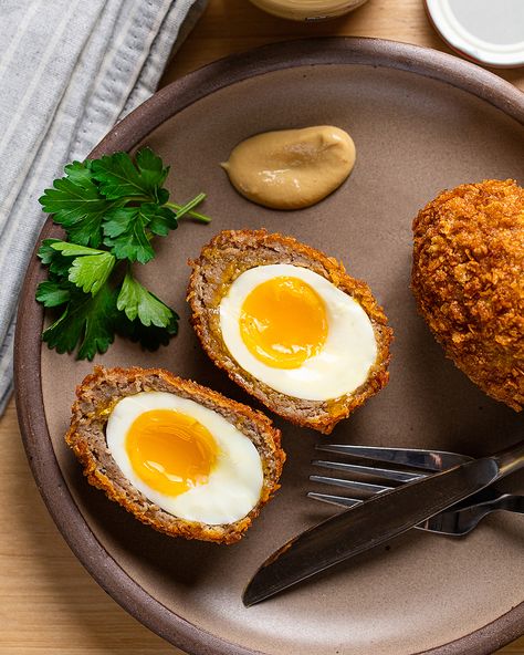 Have you always dreamed of bringing the taste of the corner pub home for breakfast? Us, too! That’s why we whipped up this recipe for Scotch Eggs. Made with soft-boiled eggs, crumbly sausage, and crispy corn flakes, Scotch Eggs are a textural delight. They feel like an extra special treat when you make them at home. Try them for a weekend breakfast, happy hour, or Easter brunch. Maple Sausage, Scotch Eggs Recipe, Sausage Wrap, Scotch Egg, Crispy Corn, Scotch Eggs, Soft Boiled Eggs, Weekend Breakfast, Corn Flakes