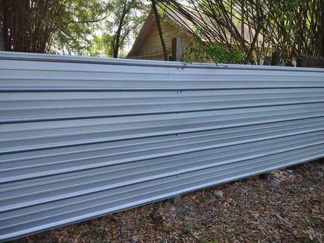 horizontal metal panel fence Corrugated Tin Fence, Tin Fence Ideas Diy, Metal Sheet Fence Ideas, Diy Metal Fence Ideas, Steel Panel Fence, Metal Panel Fence Ideas, Corrugated Metal Deck Skirting, Corrugated Metal Fence Ideas, Diy Corrugated Metal Fence