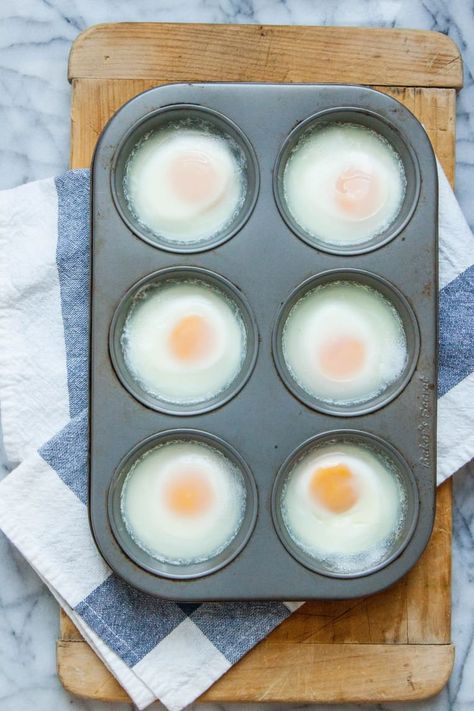 Can You Really Make Poached Eggs in the Oven? | Kitchn Eggs In A Muffin Tin, Eggs In The Oven, Eggs In Oven, Eggs In Muffin Tin, How To Make A Poached Egg, Muffin Tin Recipes, Baking Muffins, Cooking Spray, Large Numbers