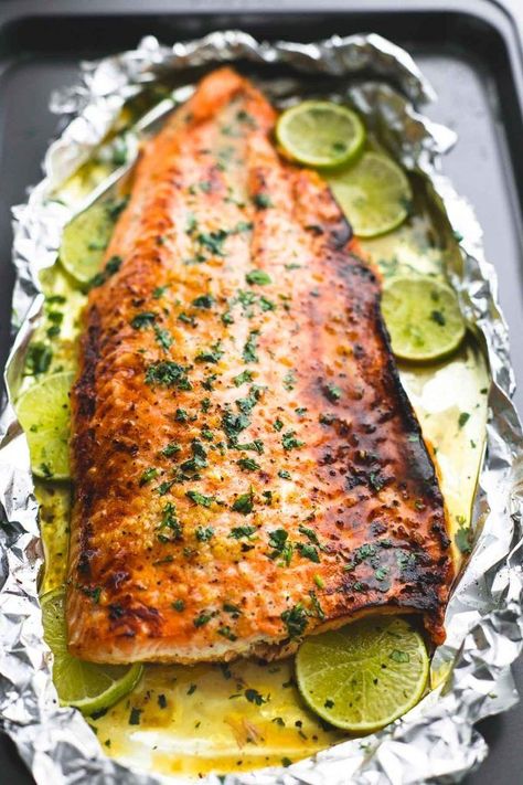 Baked honey cilantro lime salmon in foil is cooked to tender, flaky perfection in just 30 minutes with a flavorful garlic and honey lime glaze. Honey Cilantro Lime Salmon, Cilantro Lime Salmon, Lime Glaze, Fry Fish, Salmon In Foil, Lime Salmon, Baked Salmon Recipes, Salmon Dishes, Fish Dinner