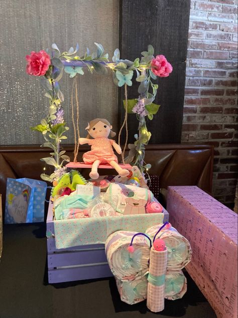 Lighted Flowers and Butterfly Theme with Receiving Blankets, Flowers, Lights, Doll on Swing, filled with gifts. Butterfly Gift Basket, Fairy Baby Showers, Bebe Shower, Girl Gift Baskets, Baby Shower Baskets, Baby Shower Gift Basket, Diy Baby Shower Gifts, Butterfly Baby Shower, Baby Gift Basket