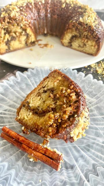 Helen Karatzas on Instagram: "BAKLAVA BUNDT CAKE Baklava bundt cake, a symphony of flavors and textures, a decadent mixture of chopped pistachios, walnuts, and almonds, creating a nutty mosaic within the cake. As it bakes, the layers meld together, forming a moist and flavorful treat. You can generously drizzle with a luscious honey syrup, infusing each bite with the sweet nectar. The result is a harmonious blend of the classic baklava essence, reimagined in a delightful bundt cake form. Enjoy love @helens.kouzinaki ❤️ Baklava Topping ~ 1 cup walnut 1/2 cup almonds 1/2 cup pistachio 2 1/2 tsp ground cinnamon 5 tbsp unsalted butter melted 1/4 cup honey Cake Batter~ 1/2 cup plus 2 tbs Greek plain yogurt 1/2 cup olive oil 1/4 cup milk 2 large eggs 1 1/2 cups plain flour 1 1/2 tsp baking Baklava Bundt Cake 12 Tomatoes, Baklava Bundt Cake, Cake Form, Cake Bunting, Walnut Cake, Honey Syrup, Honey Cake, Plain Yogurt, Treat You