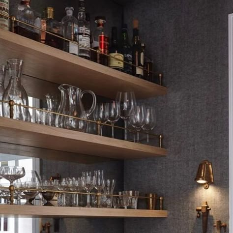 Maison Blonde on Instagram: "Some things I love about this wet bar: the unlacquered brass accents; the fluted, warm wood millwork; the brass rails on the shelves; the wallpaper that makes the space feel cozy; the mirror backsplash; the styling; those crystal champagne glasses; and lastly, the finger pulls on the drawers instead of hardware. So basically everything 💁🏼‍♀️⠀⠀⠀⠀⠀⠀⠀⠀⠀ @greyscaleinteriors @joshuamchughphotography ⠀⠀⠀⠀⠀⠀⠀⠀⠀ .⠀⠀⠀⠀⠀⠀⠀⠀⠀ . ⠀⠀⠀⠀⠀⠀⠀⠀⠀ #greyscaleinteriors #wetbar #butlerpan Shelves With Bar, Wet Bar With Mirrored Backsplash, Brass Shelves Bar, Wet Bar Mirror Backsplash, Floating Wood Shelves Bar, Fluted Glass Shelf, Dry Bar Open Shelving, Floating Shelves With Rail, Wet Bar With Mirror