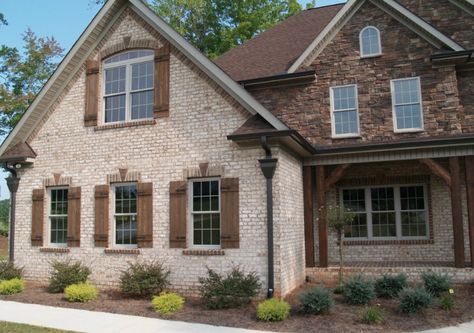 Nothing says welcome like the entrance to your home, so its important that your house's exterior is inviting and warm. Here are some of our favorite exampl Brick Craftsman House, Brown Shutters, Wood Shutters Exterior, Brick Homes, Rustic Shutters, Cedar Shutters, House Shutters, Wooden Facade, Light Brick