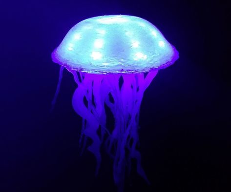 How to Make a Glowing Jellyfish (out of hot glue and LED strips) from Instructables Glowing Jellyfish, Jellyfish Lantern, Fire Crafts, Diy Jellyfish, Diy Jelly, Glow Fish, Jellyfish Decorations, Jellyfish Light, Jellyfish Craft