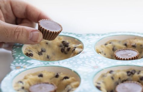 Chocolate Chip Cookie Cups is chocolate chip cookie dough baked in a muffin tin with a surprise mini Reese's Peanut Butter Cup nestled inside! Chocolate Chip Cookie Cups, Mini Chocolate Chip Cookie Cups, Cookie Cups, Cookies in Muffin Pan, Mini Chocolate Chip Cookie Recipe, Chocolate Chip Cookies Stuffed with Reese's, Reese's Chocolate Chip Cookies, Baking, Cookies, Cookie Recipes, CookieCups, i am baker, iambaker Chocolate Chip Cookie Cups Muffin Tin, Mini Chocolate Chip Cookies Recipe, Cookie Recipe Chocolate Chip, Mini Muffin Tin Recipes, Homemade Chocolate Chip Cookies Recipe, Choc Chip Cookie Recipe, Homemade Chocolate Syrup, Chocolate Chip Cheesecake Bars, Mini Chocolate Chip Muffins