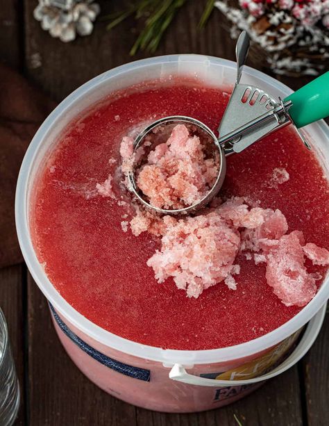 Christmas Slush Mocktail is a refreshing and festive beverage that can be enjoyed by all ages. It's made with a mixture of cranberry juice, orange juice, and lemonade concentrate, which is then frozen and served topped with cherry lemon-lime soda. Christmas Slush Mocktail, Christmas Slush, Vodka Slush, Xmas Drinks, Slush Recipes, Frozen Juice, Cranberry Vodka, Lemonade Concentrate, Frozen Christmas