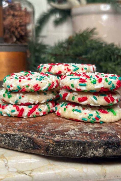 Learn how to make soft and chewy sugar cookies with sprinkles. Drop Style Christmas Sugar Cookies, Christmas Butter Sprinkle Cookies, Holiday Sprinkle Cookies, Sugar Cookie Sprinkles, Sprinkle Sugar Cookies Christmas, Christmas Sugar Cookies With Sprinkles, Sprinkle Christmas Cookies, Sugar Cookies Aesthetic, Christmas Cookies With Sprinkles