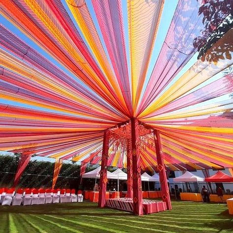 Tent Mandap Decoration, Wedding Garba Decorations, Colourful Haldi Decor, Gazebo Mandap Decor, Indian Wedding Tent Decorations, Village Wedding Decoration, Garba Ground Decoration, Carnival Wedding Theme Indian, Wedding Lawn Decorations Indian