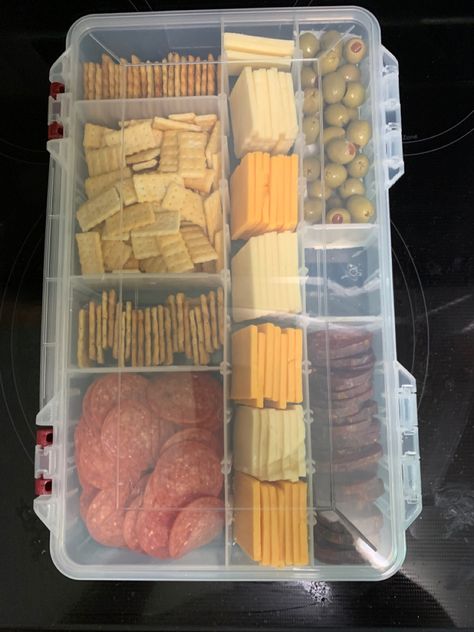 I used a new tackle box and washed it. Then added our favorite sliced cheeses, crackers and meat. I then lined one section with a paper towel and added olives. Lake Snacks, Vacation Snacks, Boat Snacks, Beach Snacks, Boat Food Ideas, Camping Snacks, Road Trip Food, Vacation Meals, Road Trip Snacks