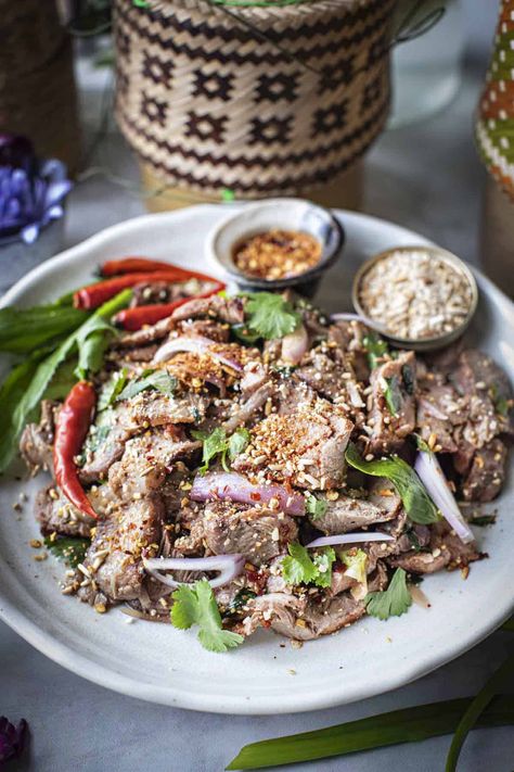 Looking for a healthy, quick, and flavorful dish? Look no further! This Moo Nam Tok Thai Grilled Pork Salad recipe is the perfect choice! #moonamtok #thaiporkwaterfall #porkwaterfallsalad #namtokmoo #namtokrecipe #thaigrilledpork #thaigrilledporksalad #moonamtokrecipes Pork Thai Recipes, Vietnamese Marinated Pork, Thai Grilled Pork, Thai Pork Salad, Vietnamese Noodle Bowl With Grilled Pork, Pork Salad Recipes, Mookata Thai Bbq, Vietnamese Lemongrass Pork, Crunchy Asian Salad