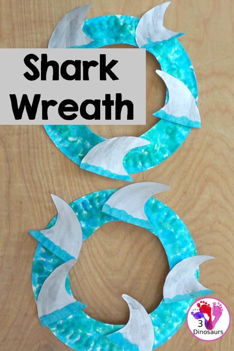 Shark Fin Wreath Craft for Shark Week | 3 Dinosaurs Toddler Shark Craft, Shark Week Art Projects For Kids, Shark Week For Toddlers, Shark Craft For Preschool, Easy Shark Craft, Shark Art Project, Shark Week Crafts For Toddlers, Shark Art For Toddlers, Easy Shark Crafts For Kids