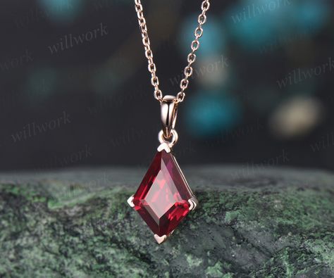 ***This stunning red ruby necklace features a 14k rose gold chain and kite-cut red ruby stone, which is minimalist and stylish. Perfect for the modern woman looking for a unique and elegant daily wear necklace***- Metal: Solid gold(14K/18K white/yellow/rose gold),925 sterling silver, platinum available- Main Stone: 7x10mm kite cut lab red ruby- Chain: 16+2 inches. The chain can be adjustable to 18 Inches.- Can be personalized: Yes Red Topaz Necklace, Luxury Rose Gold Ruby Necklaces, Gold Ruby Jewelry, Ruby Amulet, Daily Wear Necklace, Red Ruby Necklace, Trillion Engagement Ring, Ruby Chain, Moissanite Ring Set