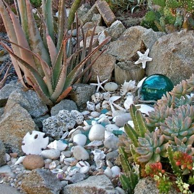 ah, hyperventilating! This is EXACTLY the look I'd love to have in our San Diego front yard, succulents (which I tend to actually be able to keep alive!) along with the coastal theme. One of her other photos even has Hot Wheels in the rocks. could it be more perfect (my son is 9) Nautical Landscaping, Toilet Selfie, Vintage Outdoor Decor, Cottage Patio, Balinese Decor, Hamptons Decor, Seaside Garden, Backyard Beach, Outdoor Living Design