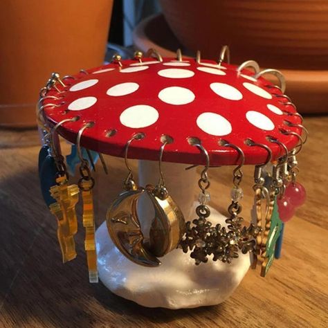 This red amanita mushroom earring holder is a stylish way to keep your earrings and pendants organised and also a eye catching piece of decor perfect for fairycore/cottagecore aesthetic lovers. Package includes: 1x Mushroom Earring Holder Size: ~3.15x3.7in (~9.5x7.5cm), 26 holes Material: Polymer Clay Mushroom Earring Holder, Mushroom Earring, Jewelry Display Organizer, Mushroom Jewelry, Earring Display Stands, Jewelry Rack, Earring Storage, Jewelry Display Stands, Earring Organizer