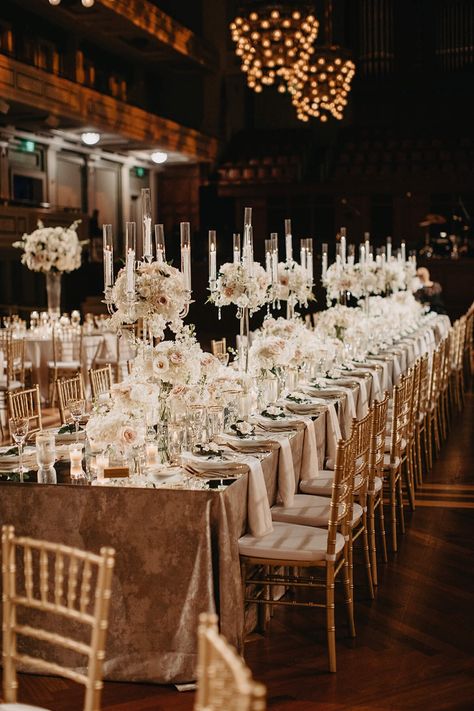 The stunning elegant and romantic wedding reception decor for Madison & John’s elegant Nashville wedding at Schermerhorn Symphony Center- a dreamy downtown Nashville wedding venue. Their wedding tablescapes included elegant white flower centerpieces with candles and gold cutlery. We offer luxury wedding planning in Nashville, Tennessee, and beyond. Dreamy wedding décor, elegant wedding décor, wedding reception décor Nashville Symphony Wedding, Flower Centerpieces With Candles, White Wedding Flower Arrangements, Wedding Flower Table Decorations, White Flower Centerpieces, Timeless Wedding Decor, Wedding Luncheon, Romantic Wedding Centerpieces, Baroque Wedding