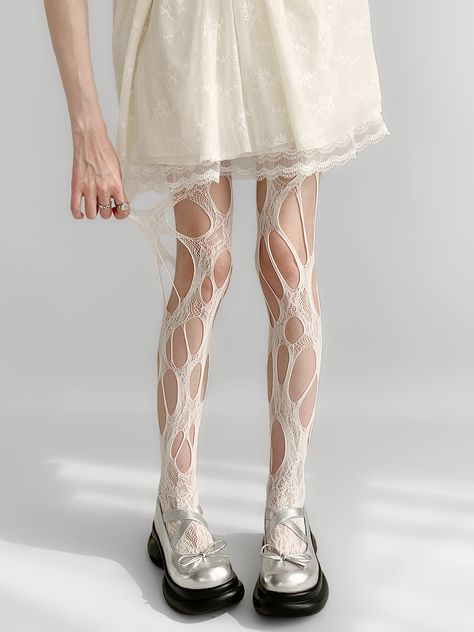 Get ready to turn heads with these edgy cut-out design punk fishnet tights. Available in white, black, or brown, these tights are the perfect addition to any kawaii or lolita wardrobe. The intricate cut-out design adds a touch of punk flair.  Please note that this product includes a single pair of tights. Black And White Tights, Fishnet Outfit, Net Socks, Ripped Tights, Steampunk Fashion Female, White Fishnets, Fishnet Socks, Gothic Skirts, White Tights