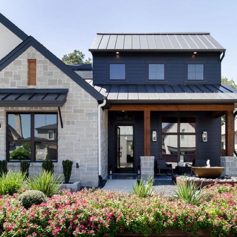 Black House Exterior With Lush Landscaping | HGTV Moody Exterior, Black Siding, Modern Exteriors, Black Metal Roof, Moody Modern, Black Cabin, Indian Temple Architecture, Exterior House Color, Hollywood Homes