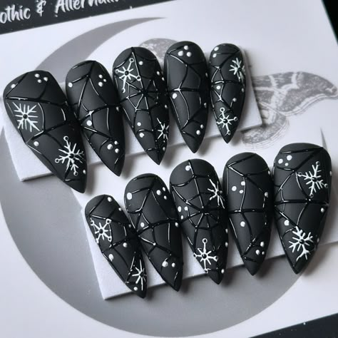 Gothic winter nails: where snowflakes meet spiderwebs, because even in the cold, we’re keeping it cool and spooky! ❄️🖤🕸️ Snowtrap, on Après Medium Stiletto 💅🏻 ⁣ .⁣ .⁣ .⁣ .⁣ .⁣ #gothnailsofinstagram #stayspooky #blacknails #halloweenforever #creepmas #gothicxmas #wintergoth #winternails #nailartist #gothicchristmas #spiderwebnails #spookychristmas #pressonnailset #seasonscreepings #gothvibes #gothicnails #gothmas #gothxmas #merrycreepmas #christmashalloween #gothstagram #gothstyle #gothchrist... Goth Medium Nails, Goth Christmas Nails Designs, Spooky Winter Nails, Alternative Nail Art, Winter Goth Nails, Witchy Christmas Nails, Gothic Winter Nails, Gothmas Nails, Creepmas Nails