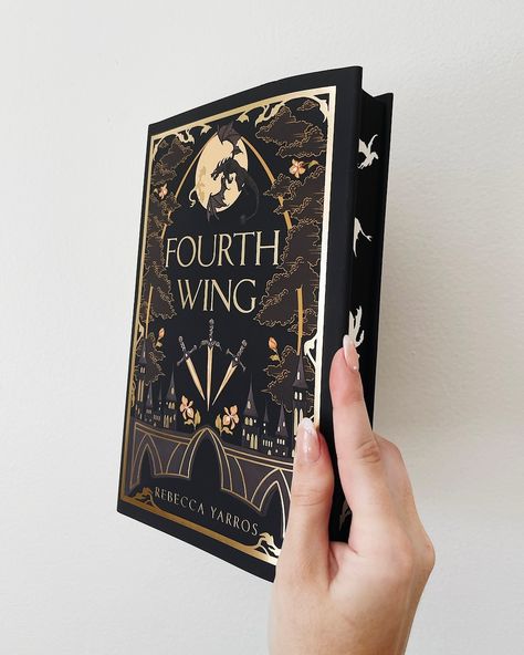 you all freaked over the gold/light version of this fourth wing dust jacket, so naturally I bought the black version too and she’s stunning ✨ @bluelyboo NEVER misses. that’s all I had to say 🫶🏻 now that I’m on summer break maybe life will finally calm down and I can read + be active on here please and thank you !!! what are you currently reading, and give me your predictive rating 💗 • • • • • • #fourthwing #prettybooks #fantasybookstagram #fantasybooks #romantasy #bookcollection #rebe... Fourth Wing Special Edition, Fourth Wing Book Cover, Book Rebinding, Wings Book, Dark Romance Books, Recommended Books To Read, Gold Light, Book Collection, Book Binding