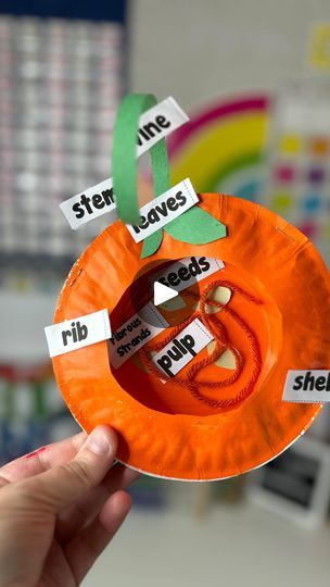 9.1K views · 344 reactions | Let’s create and label the parts of a 3d Pumpkin! 🎃 I used small paper plates for this activity and they were easier to work with. Each little learner will get 2 paper plates, one that has the center cut out (a grown up should do this step beforehand) and one not cut. The first step for each student would be to paint or color the ribbed paper plates. I used Kwik Stix paint sticks, which enabled it to dry within 5 minutes. Then staple the plates together as shown. Next, have students cut apart and glue each label to the pumpkin part. There is also an optional traceable and blank sentence strip for little learners to write how many seeds their pumpkin has. This makes an adorable bulletin board. Thanks for following Kindergarten Chaos! 💬Comment for the labels an Pumpkin Painting Preschool, Pumpkin Paper Plate Craft, Thanksgiving Sentences, Preschool Seasons, Pumpkin Centers, Seasons Preschool, Parts Of A Pumpkin, Pumpkin Life Cycle, 3d Pumpkin